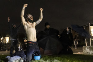 Demonstrators shout as they protest the death of Daunte Wright
