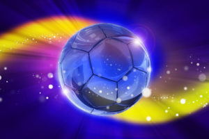 Fantasy Football Game Background with Glassy Soccer Ball in the Center and Colorful Light Rays