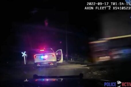 WATCH: Train slams into police car with woman handcuffed inside