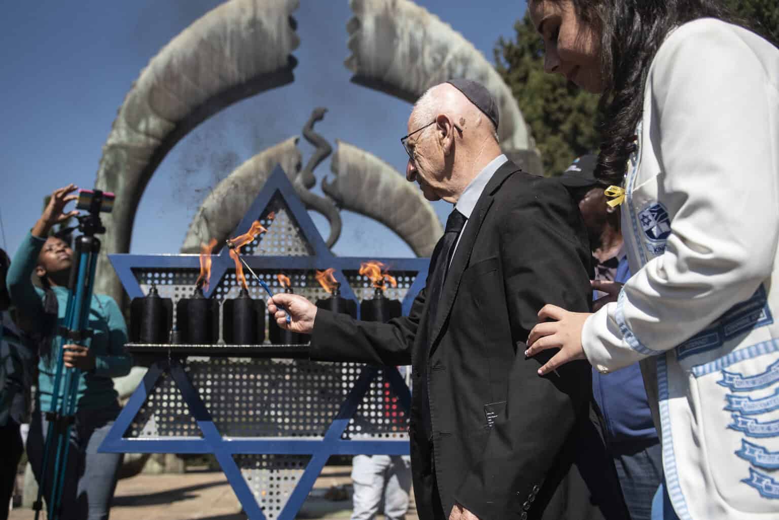 'Never give up hope': Holocaust survivors light candles on remembrance ...