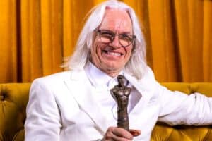 Agus Gibson holding his Lifetime Achievement Award
