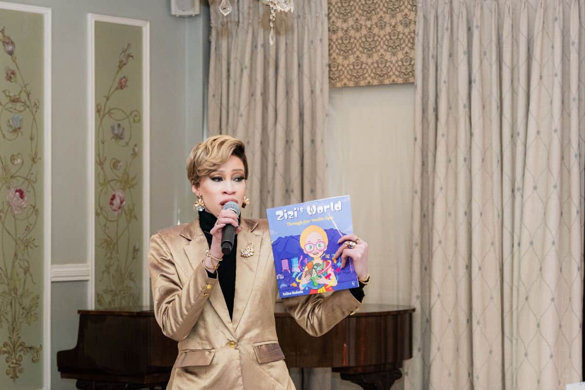 Refilwe Modiselle holding her children's book
