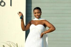 Angela Ndlela holding the keys of her new house