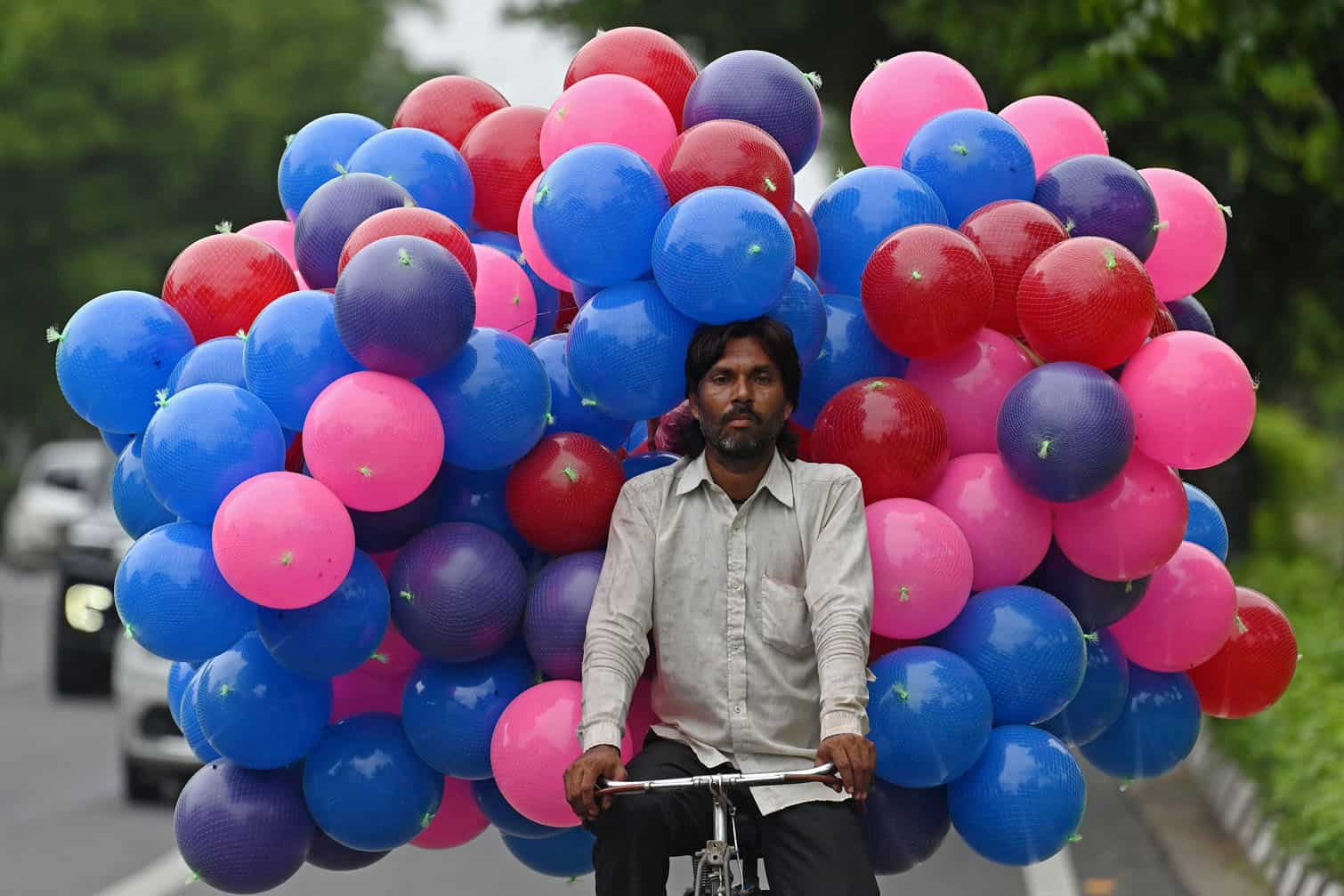 A vendor carrying plastic balls