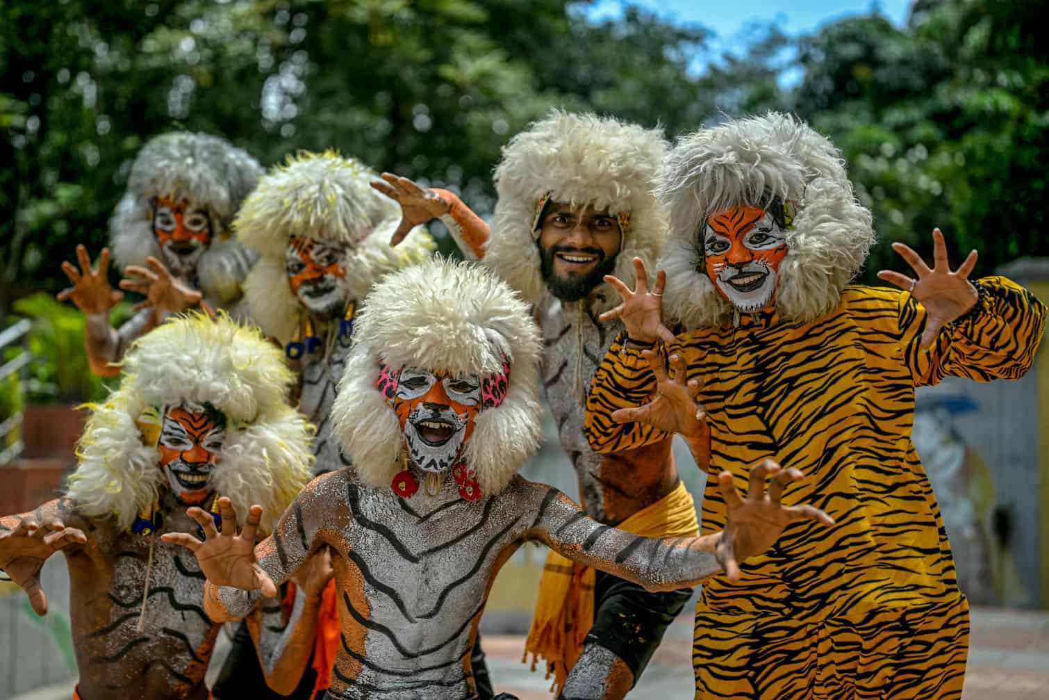 Artists dressed in tiger costumes
