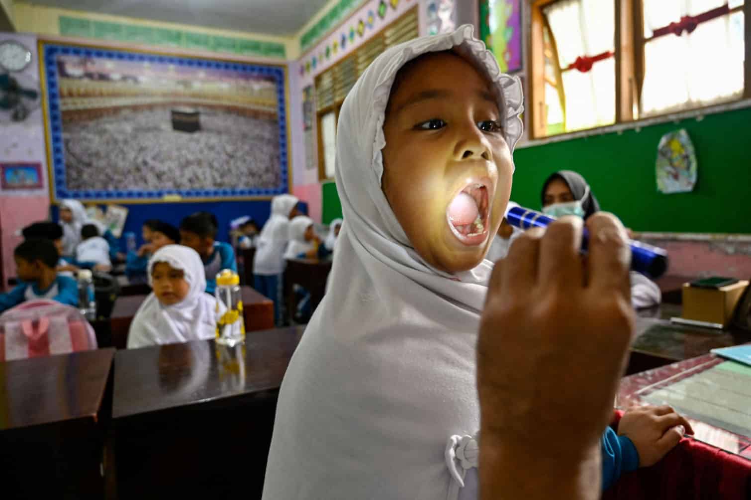 A student receives a health checkup