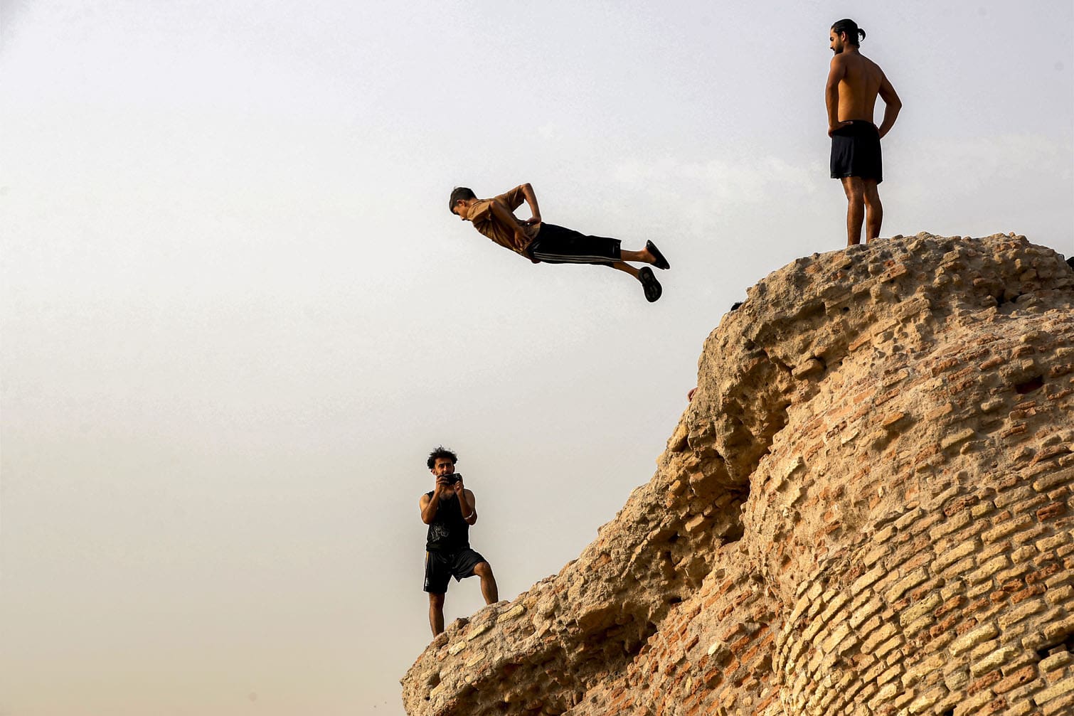 A youth dives in the Tigris river