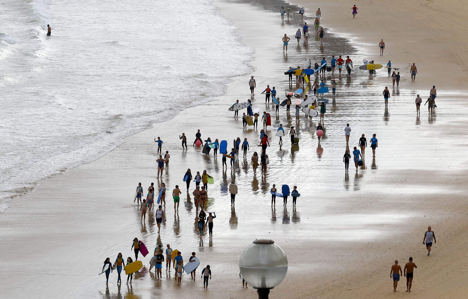 Bathers enjoy La Concha beach in San Sebastian