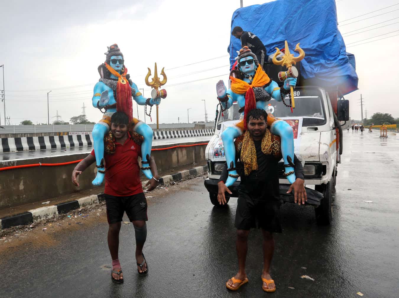 Shiva devotees carry holy water to temples in New Delhi