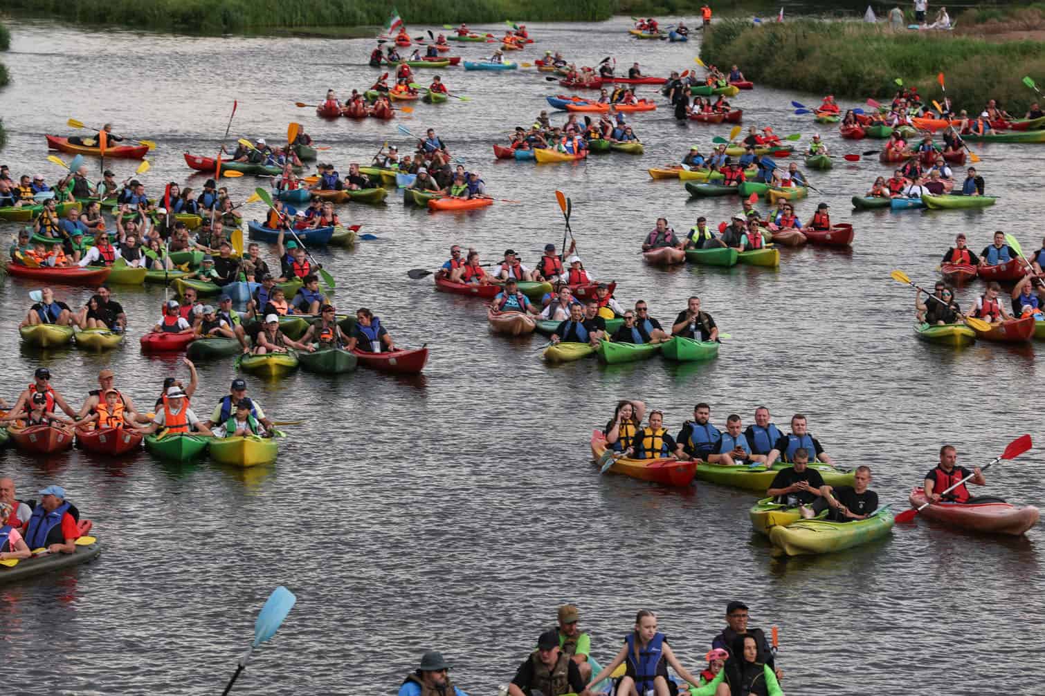 People attend Pilica Trail on Pilica River