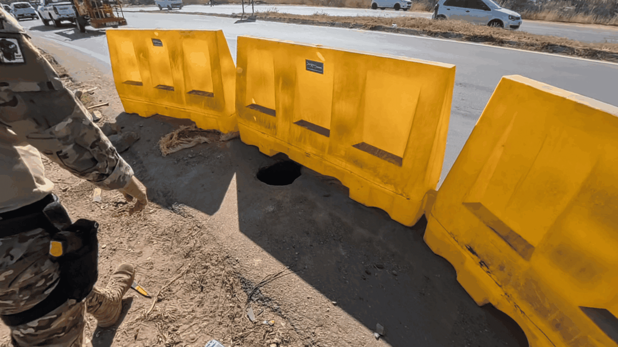 Illegal mine shaft entrance on a public road