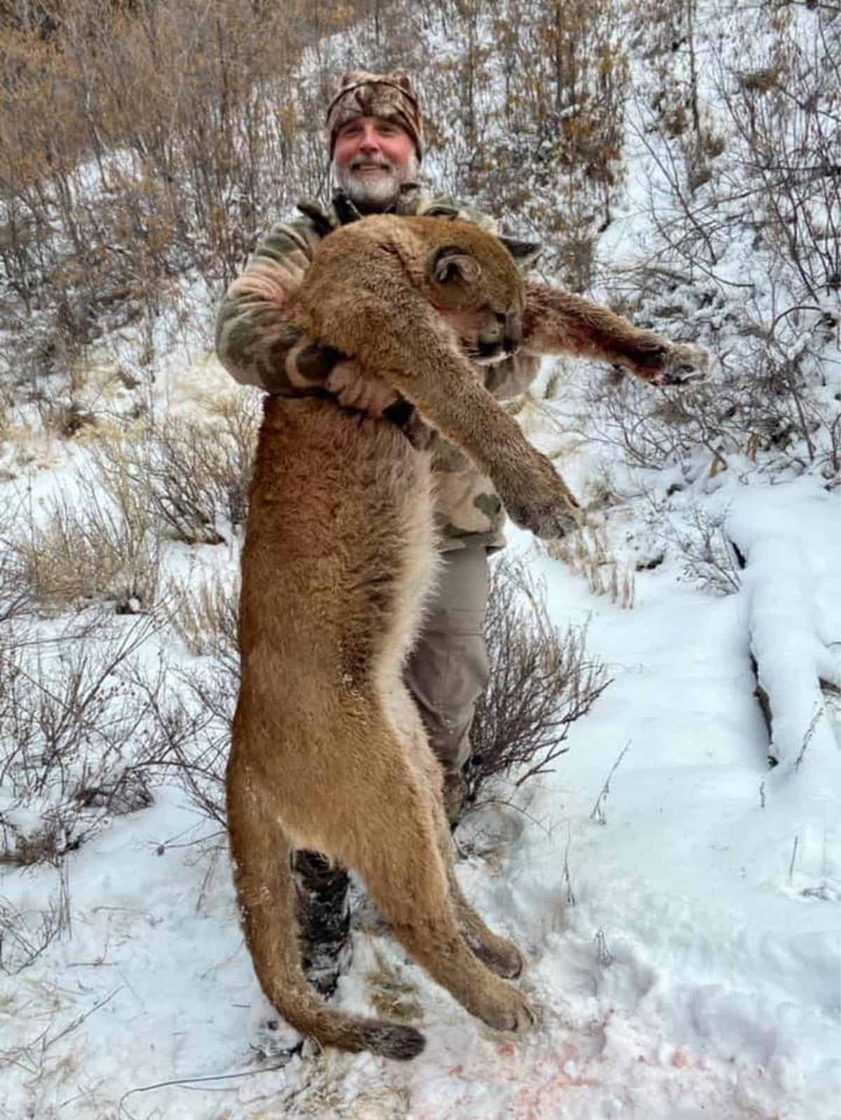 Asher Watkins with a mountain lion he had previously hunted. Picture: Asher Watkins/Facebook