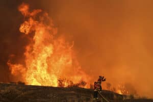 Thousands battle Greece fires as heatwave bakes Europe