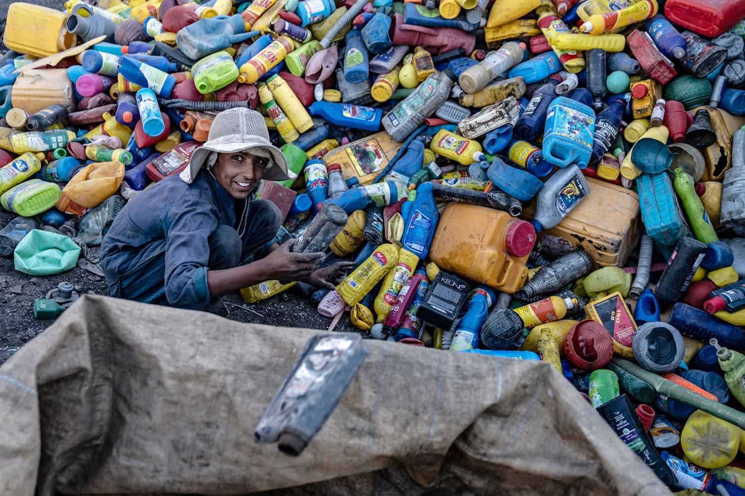 An Afghan worker sorts recyclable plastic