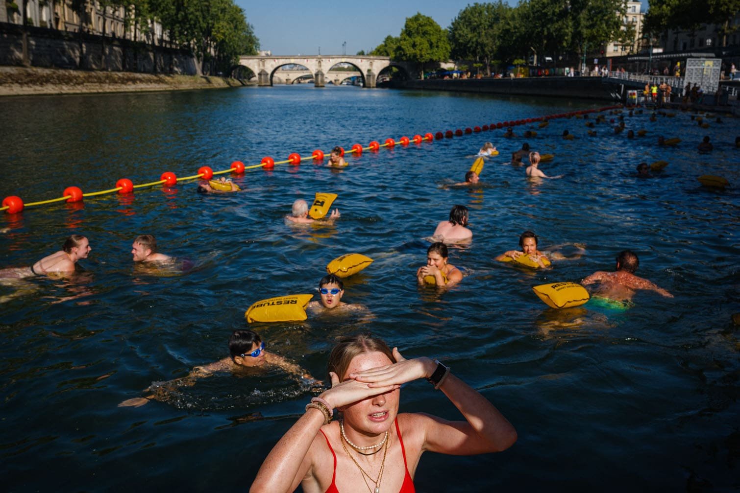 People swim at the Bras Marie safe bathing site