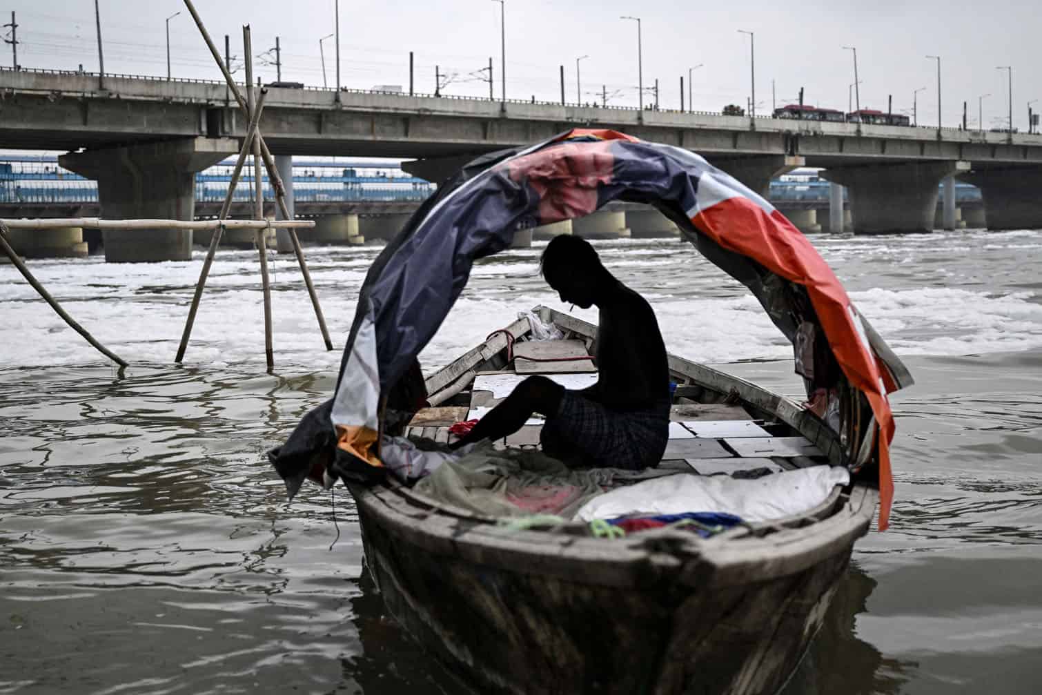 A fisherman smokes a beedi