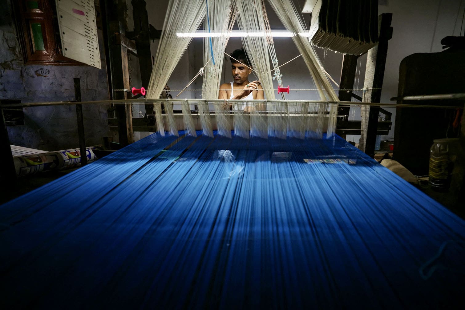 An artisan weaves a 'Banarasi saree'