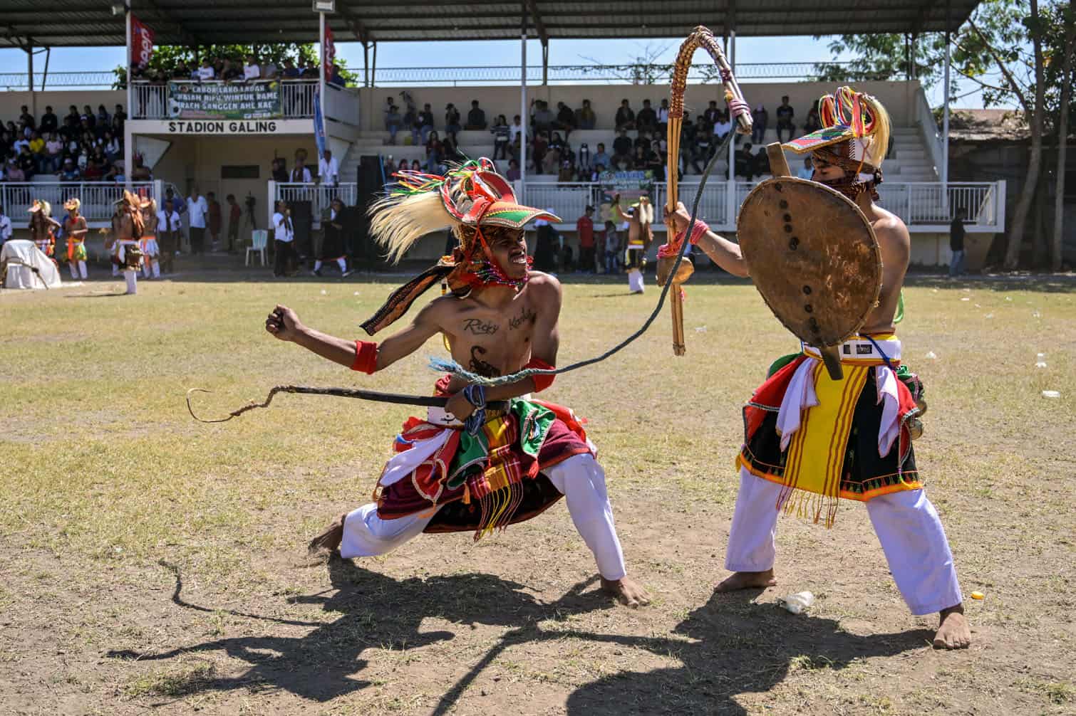 Manggarai men perform during a Caci