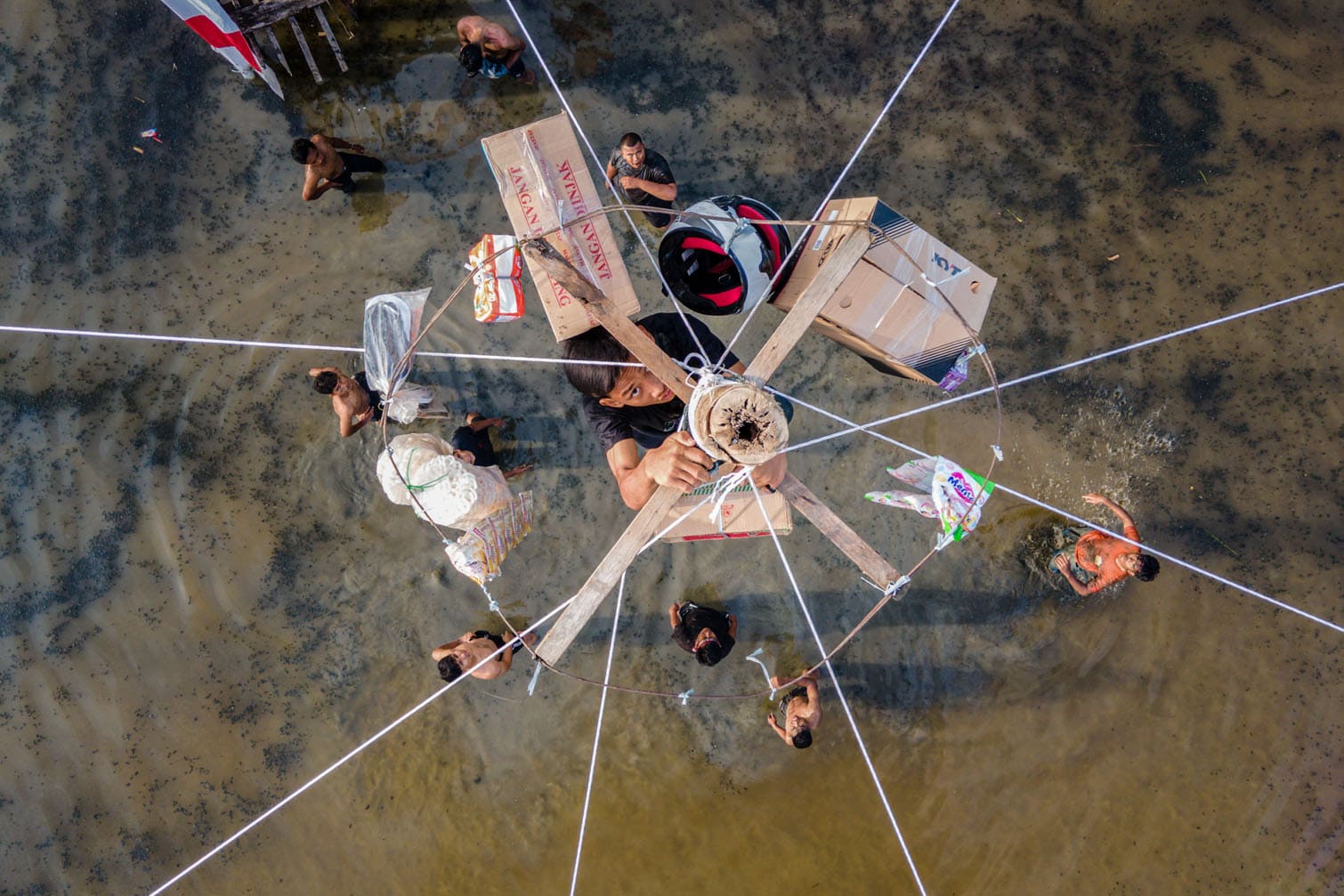 a participant climbing a greasy pole
