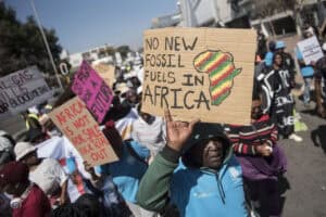 Environmental protesters demonstrate against Total