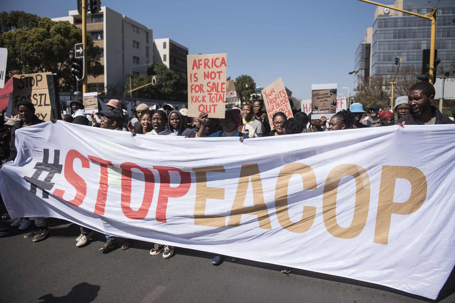 Environmental protesters demonstrate against Total