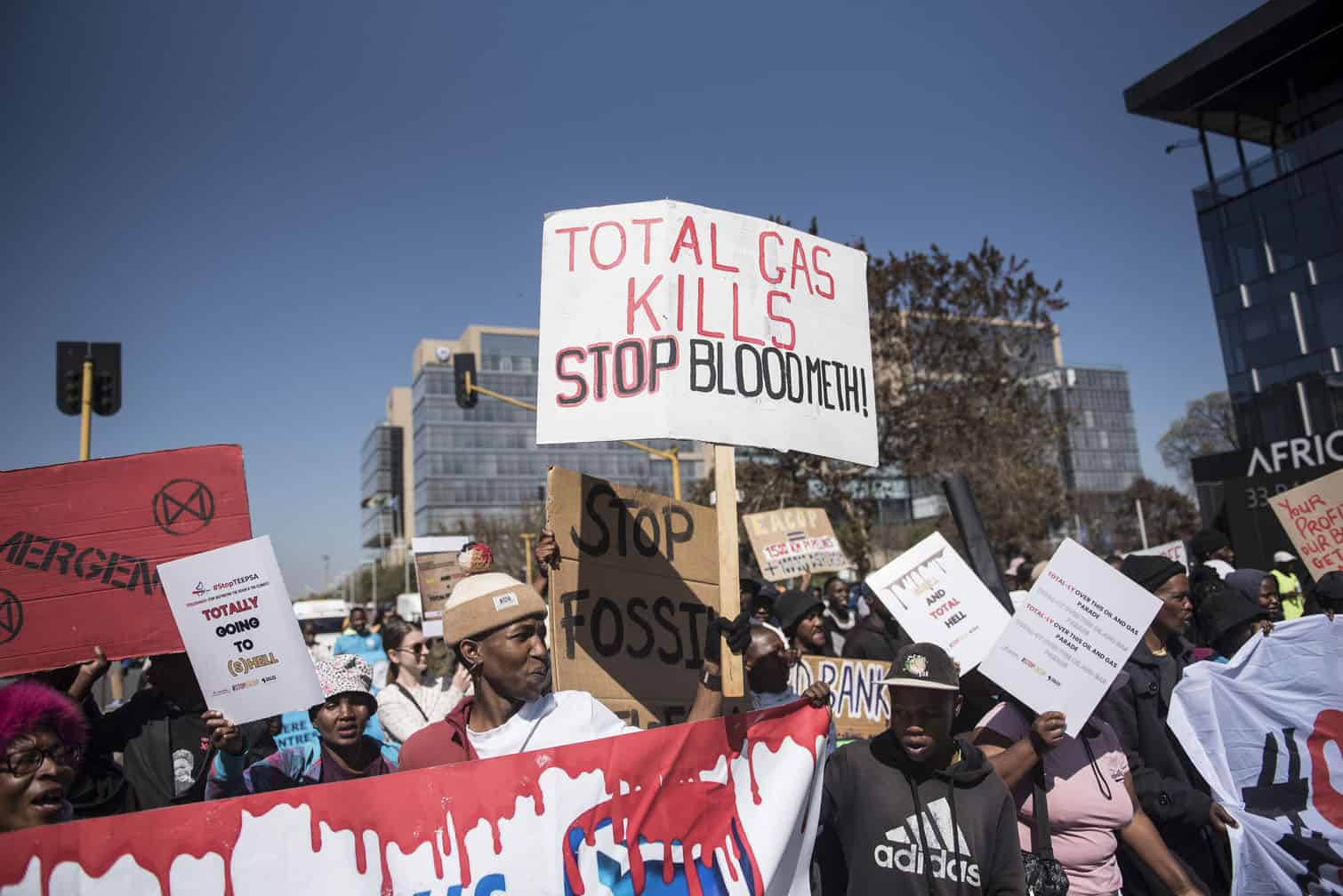Environmental protesters demonstrate against Total