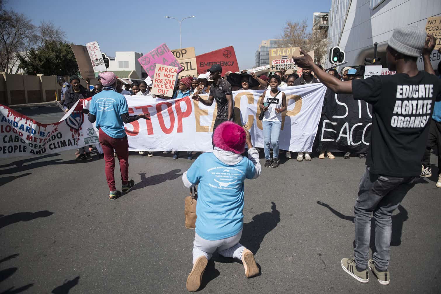 Environmental protesters demonstrate against Total