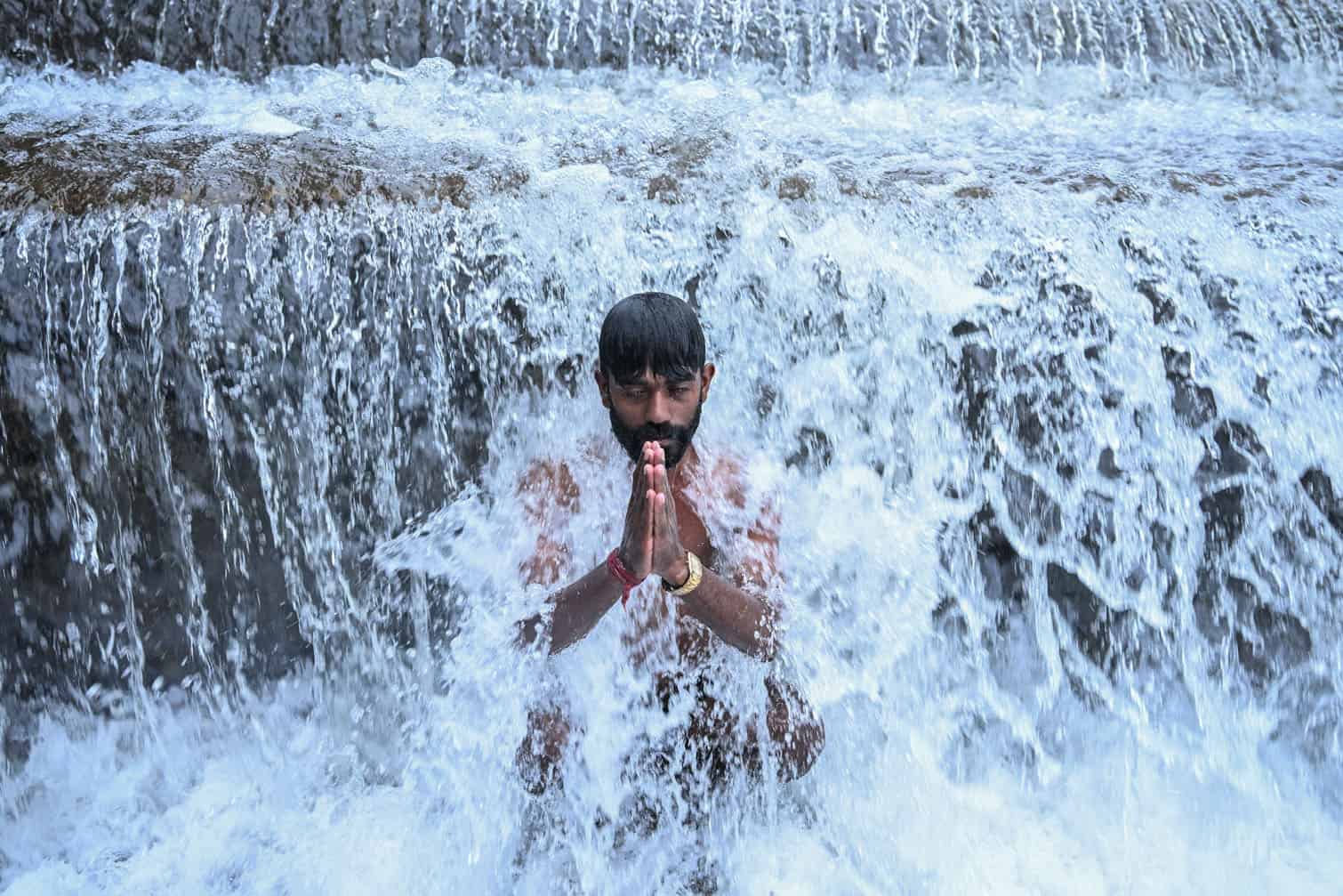 A devotee takes a holy dip in the Bagmati River
