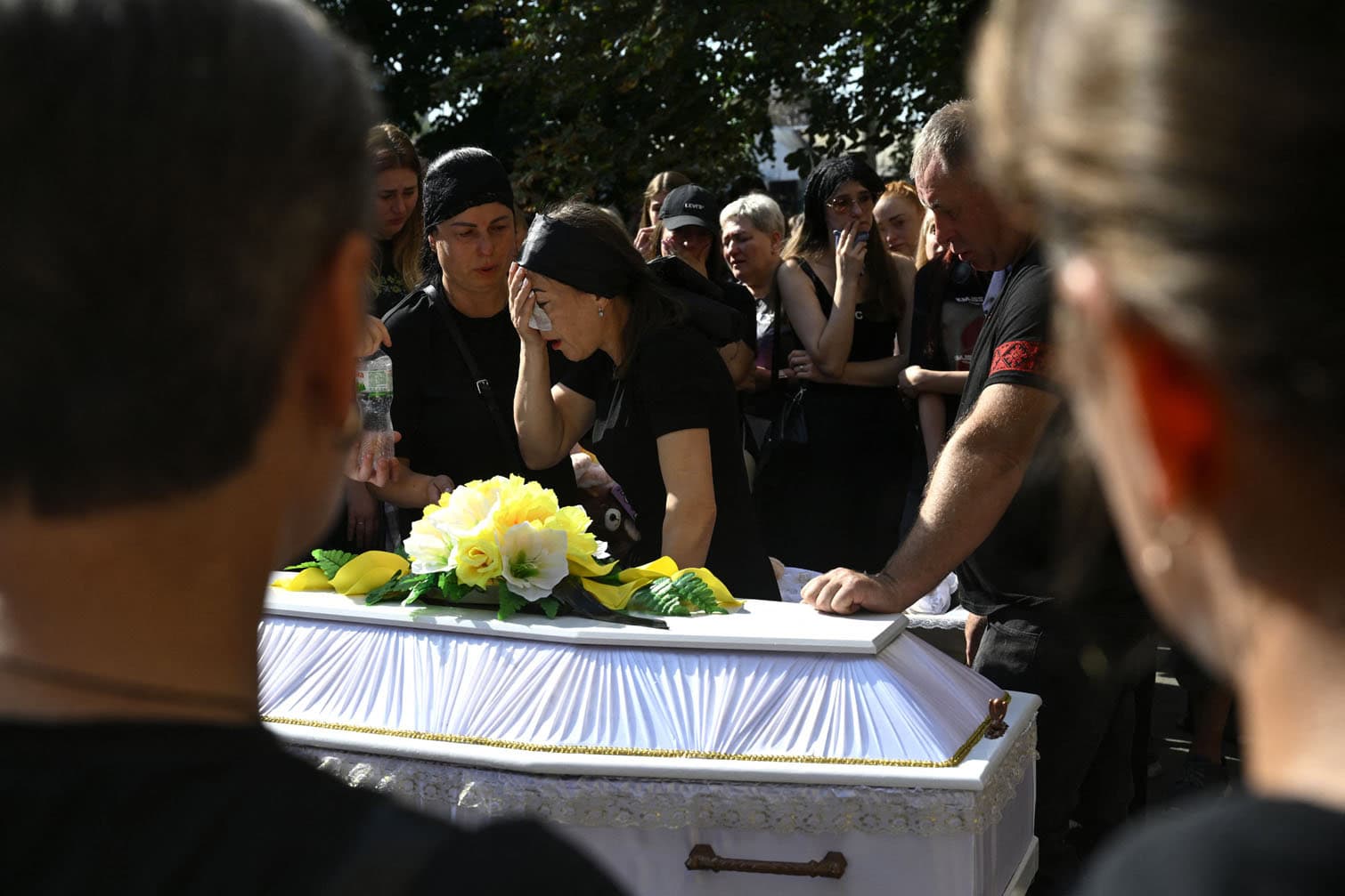 Relatives and friends mourn