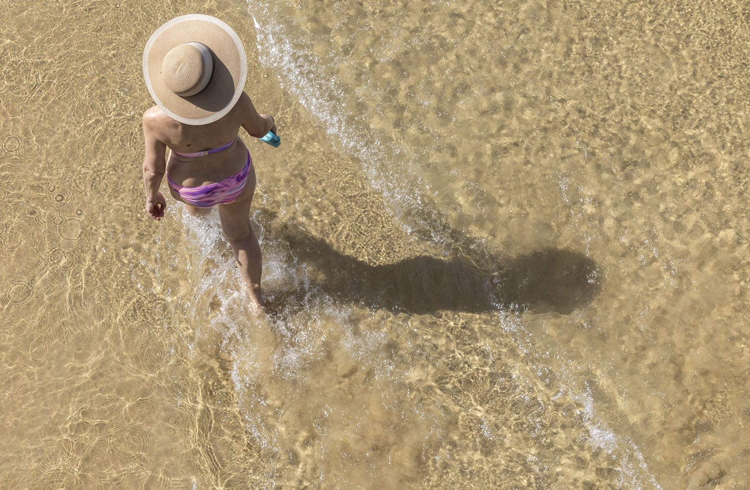 Beachgoers enjoy La Concha beach in San Sebastian