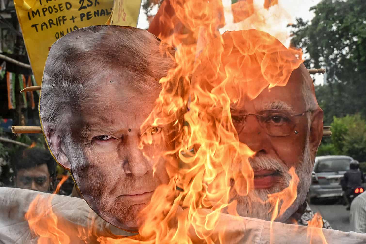 Congress activists burn an effigy of US President Donald Trump