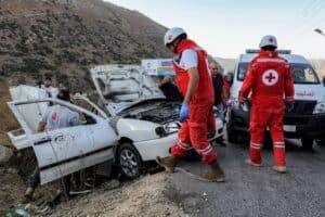 First responders and security forces' members gather at the site of an Israeli strike on a vehicle on the Khardali road in south Lebanon's Marjayoun area on September 20, 2025. Lebanon's Health Ministry said one person was killed in the strike, the latest deadly raid despite a months-old ceasefire between Israel and the Hezbollah militant group. (Photo by Rabih DAHER / AFP)