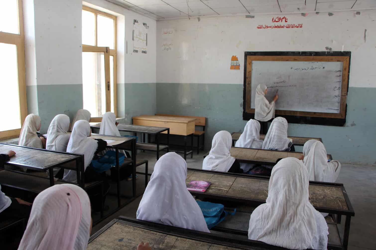 Afghan children attend primary school after summer holidays in Kandahar