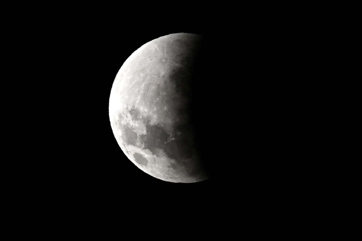 A full moon is seen over Sydney