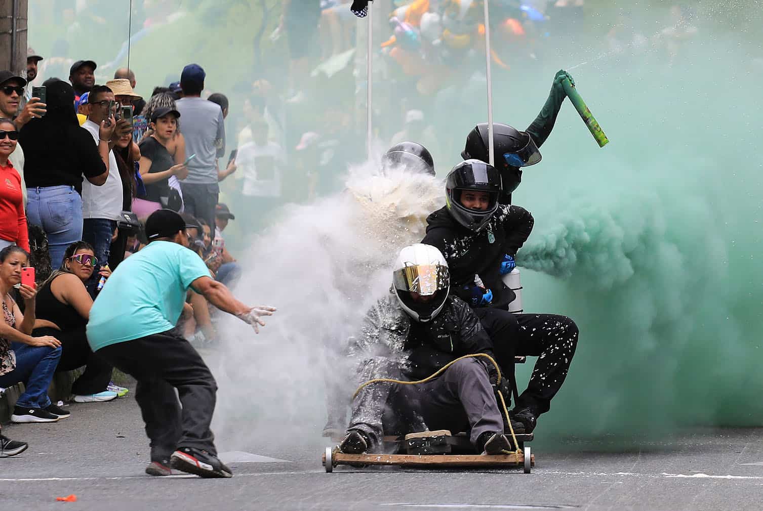 Soapbox cart riders race downhill