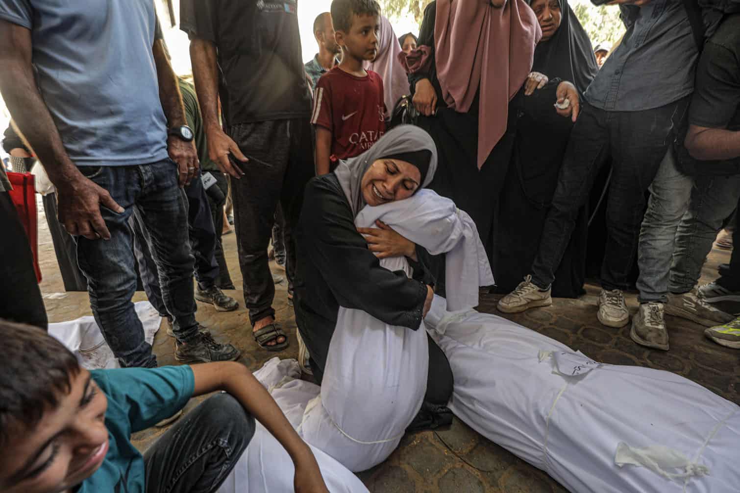 Palestinians mourn their dead as dozens are killed in Israeli strikes across Gaza