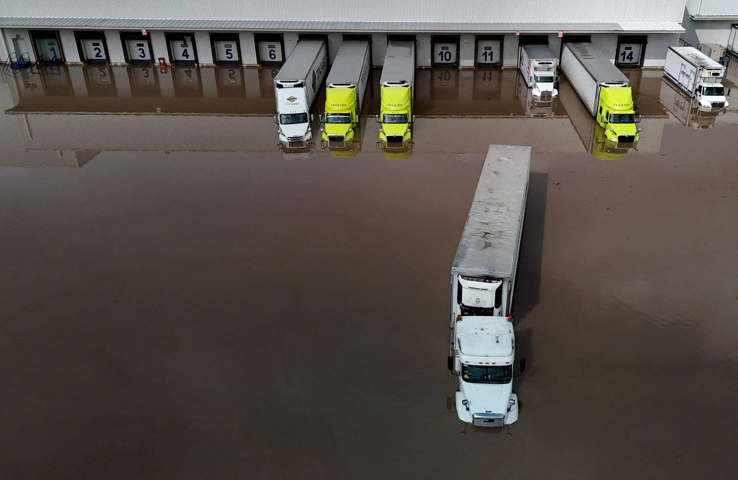 Aerial view showing semi-submerged trucks
