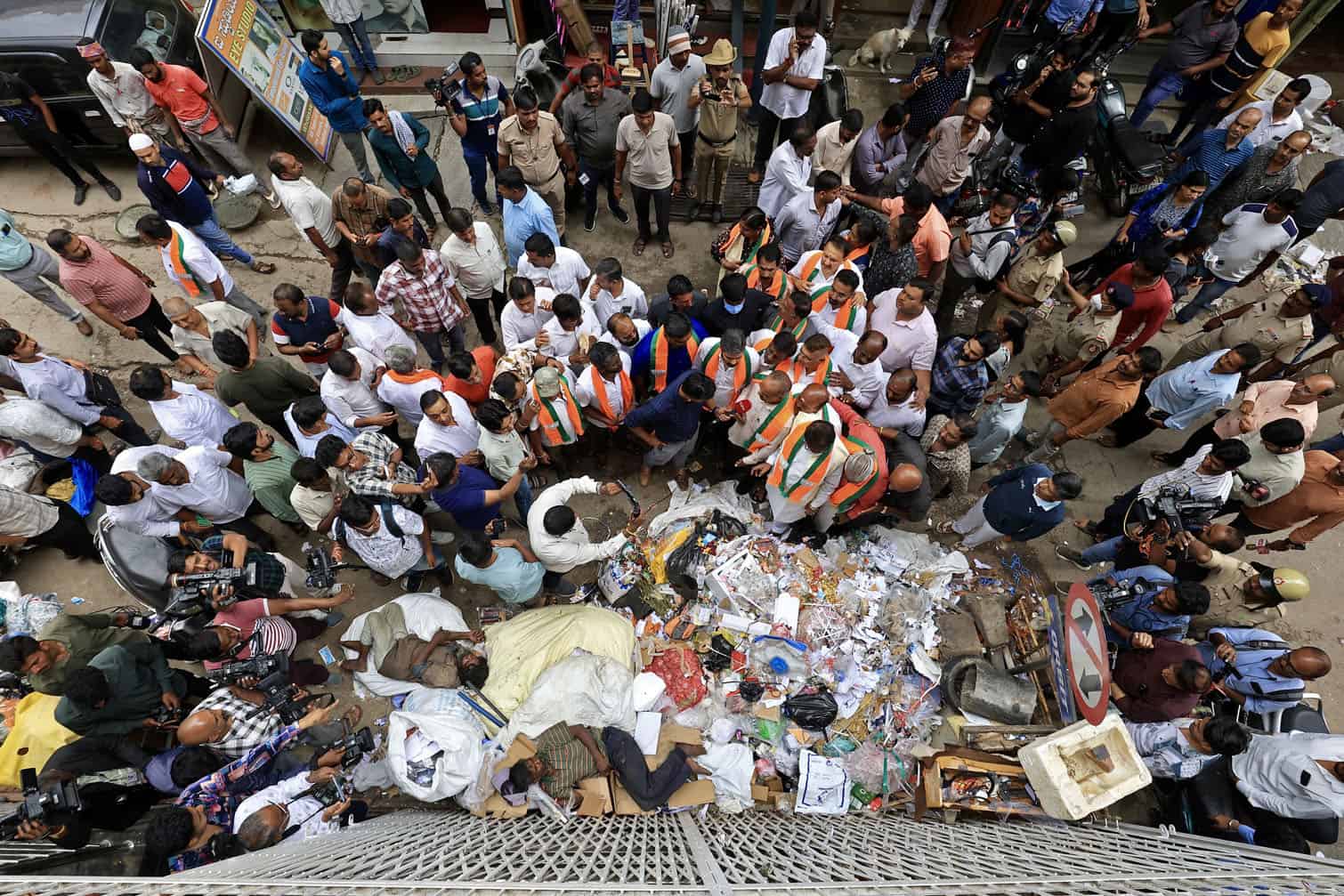 BJP members fill potholes to protest over poor infrastructure in Bangalore