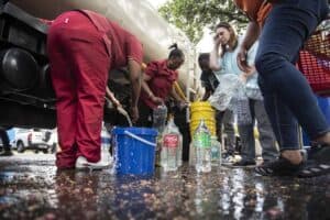 Residents line up at a water tanker in Johannesburg