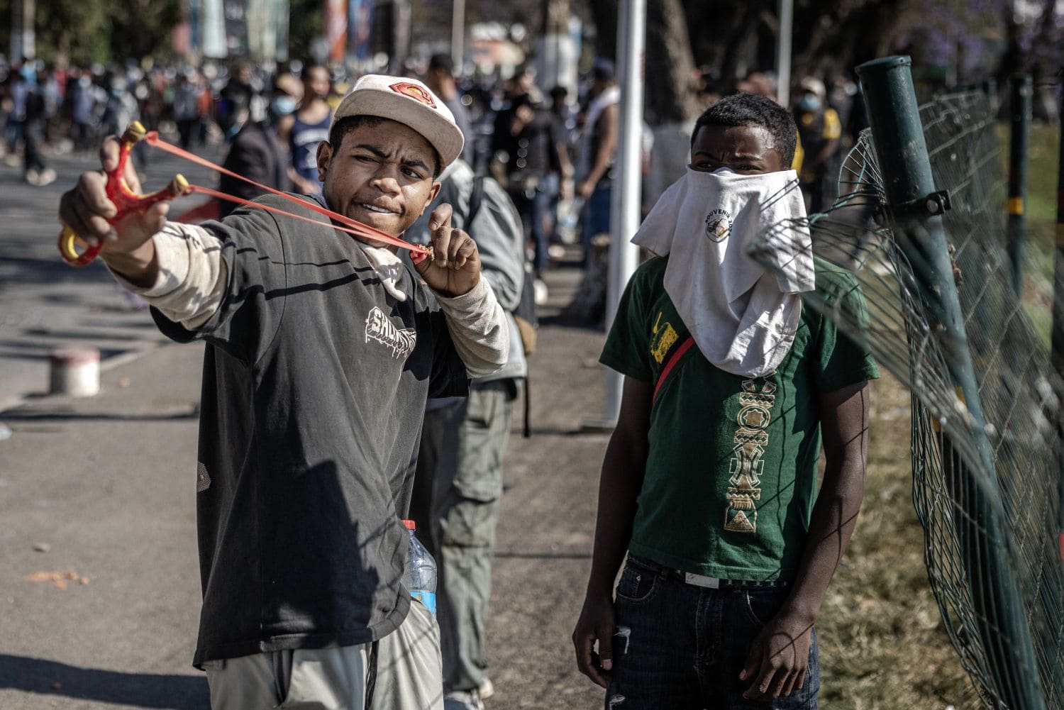 A protester uses a slingshot as thousands gathered to call for the resignation of President Andry Rajoelina in Antananarivo, Madagascar, on 11 October 2025. Picture: Luis TATO / AFP