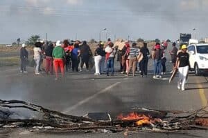 Residents protest by blocking the road on the N12.