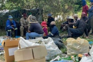A group of illegal recyclers occupy the urban green belt of Sandown Ext 24, overlooking Kramerville.