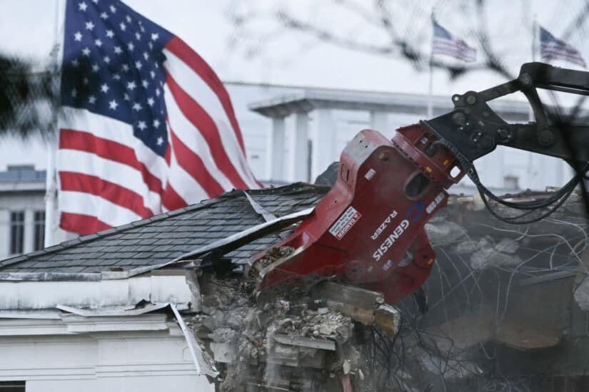 Heavy machinery tears down a section of the East Wing of the White House