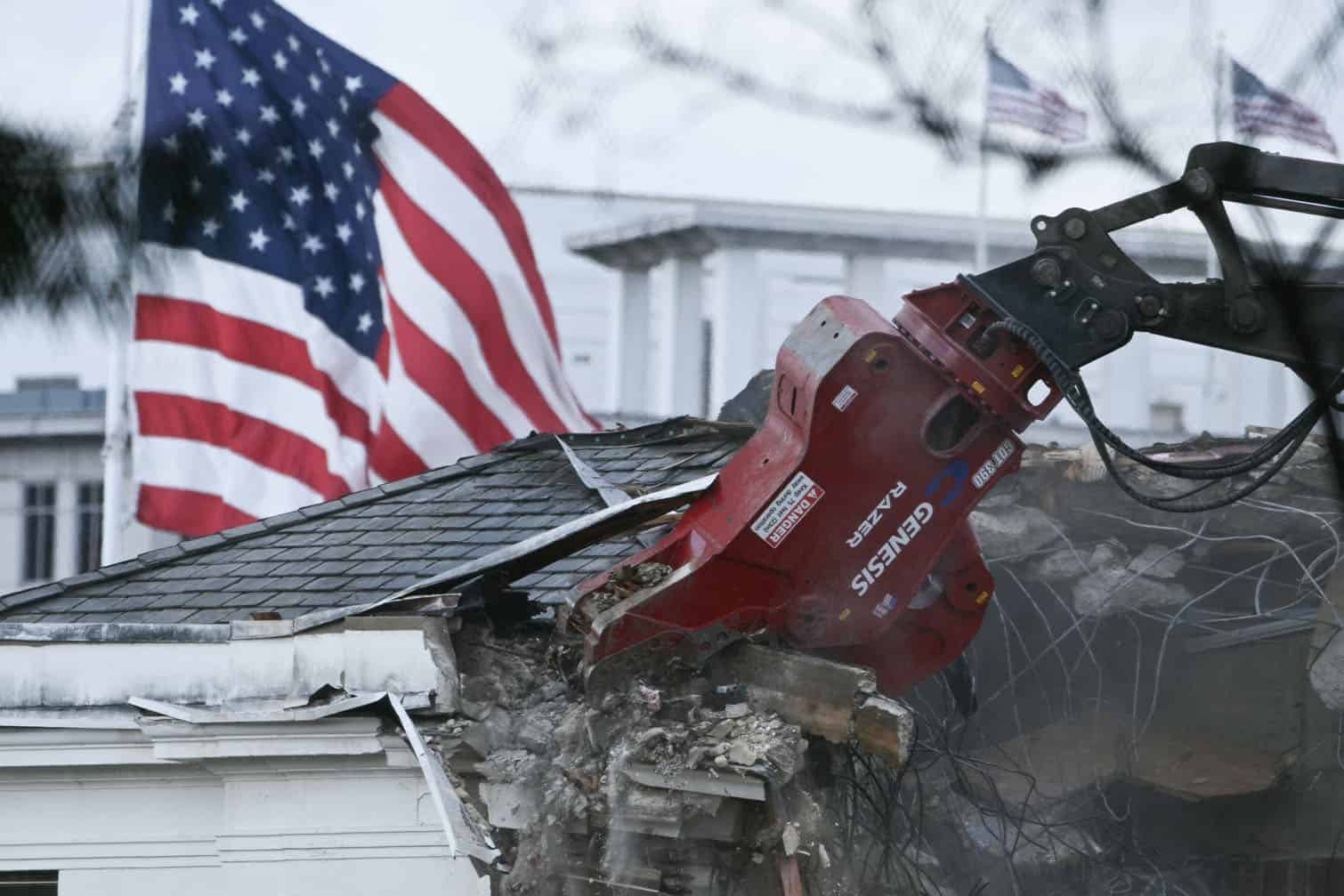 Heavy machinery tears down a section of the East Wing of the White House