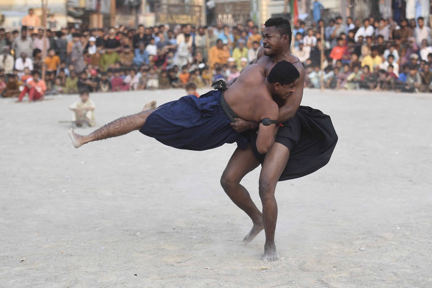 Wrestlers compete in traditional Malakhra wrestling match in Karachi