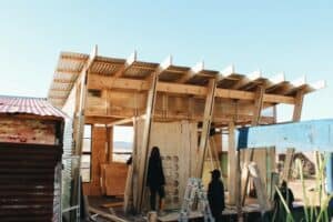 University of Pretoria architecture students work side-by-side with residents of Melusi informal settlement to construct a new community structure.