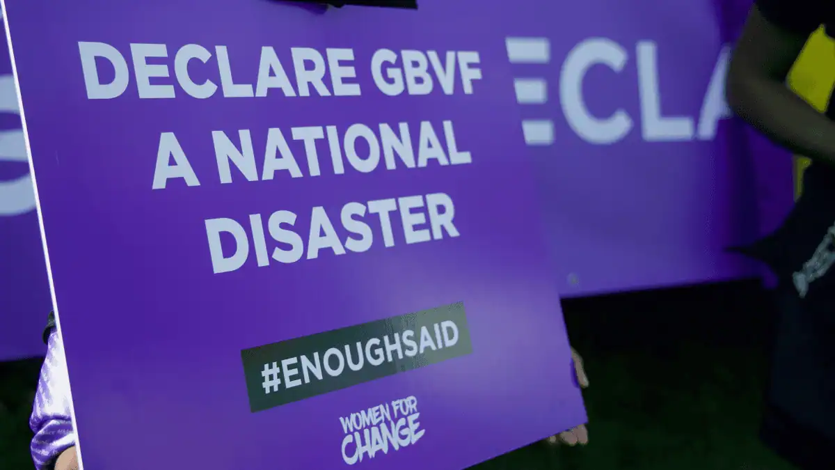 Purple ribbons demand real change