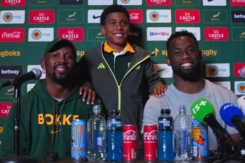 Siya Kolisi, with his son, and Springbok assistant coach Mzwandile Stick
