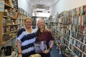Jen Yates and Jane Upton encourage residents to spend their credit at the book exchange as they close their doors on December 31.