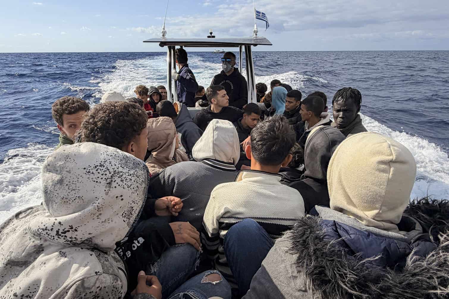Locals, helping the Greek Coast Guard in their rescue operation